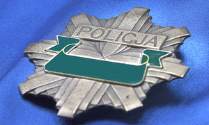 Na zdjęciu widzimy odznakę policji